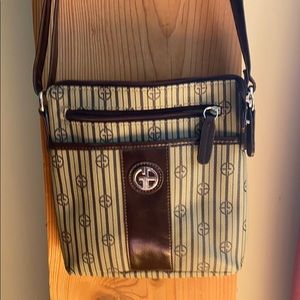 Cross body purse with long, adjustable strap.